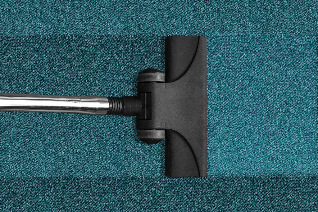 stofzuiger blauwgroen tapijt
